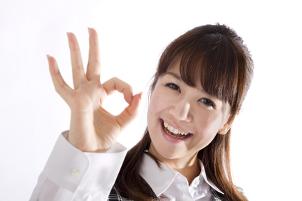 Beautiful business woman showing okay sign